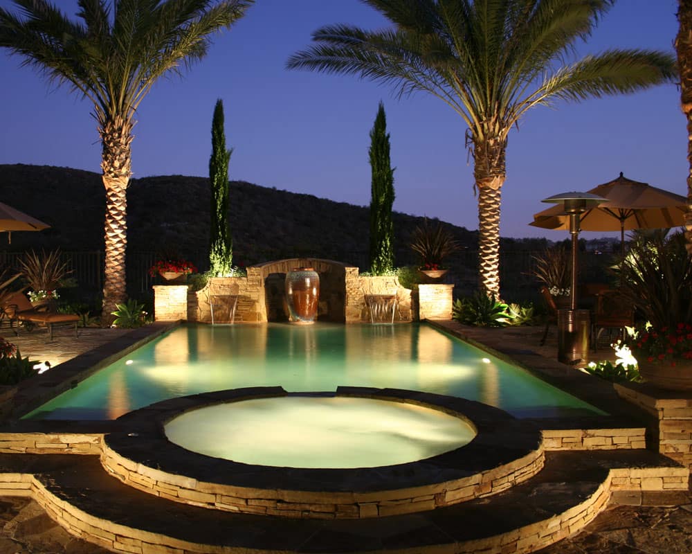 Nighttime oasis swimming pool