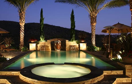 Nighttime oasis swimming pool